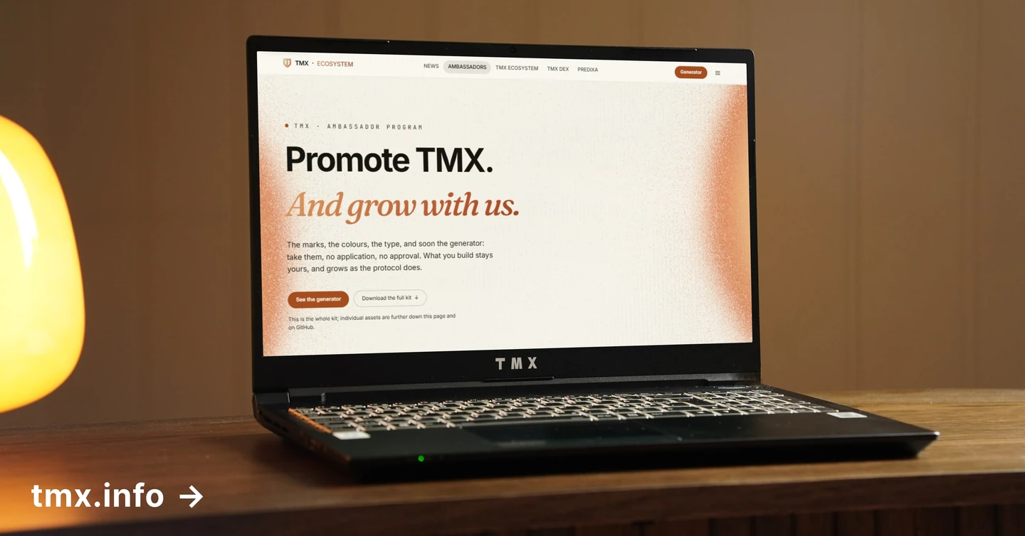 A laptop on a wooden desk beside a warm lamp, showing the TMX ambassador page with the headline 'Promote TMX. And grow with us.'